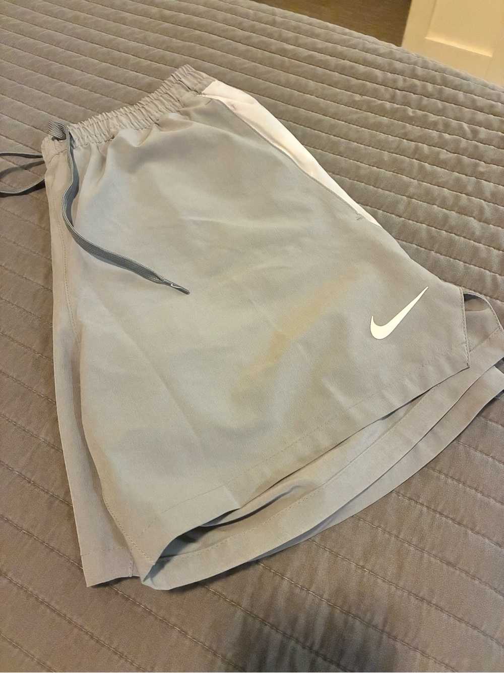 Nike Women’s Light Gray Athletic Shorts with White Swoosh